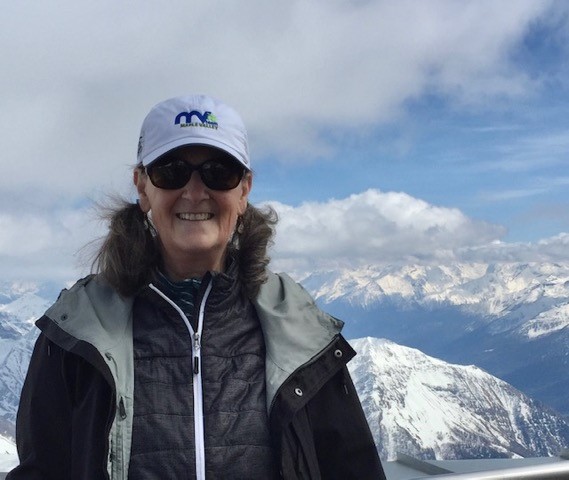 Anne, a Clinical Trials Search & Support patient, on a mountain top